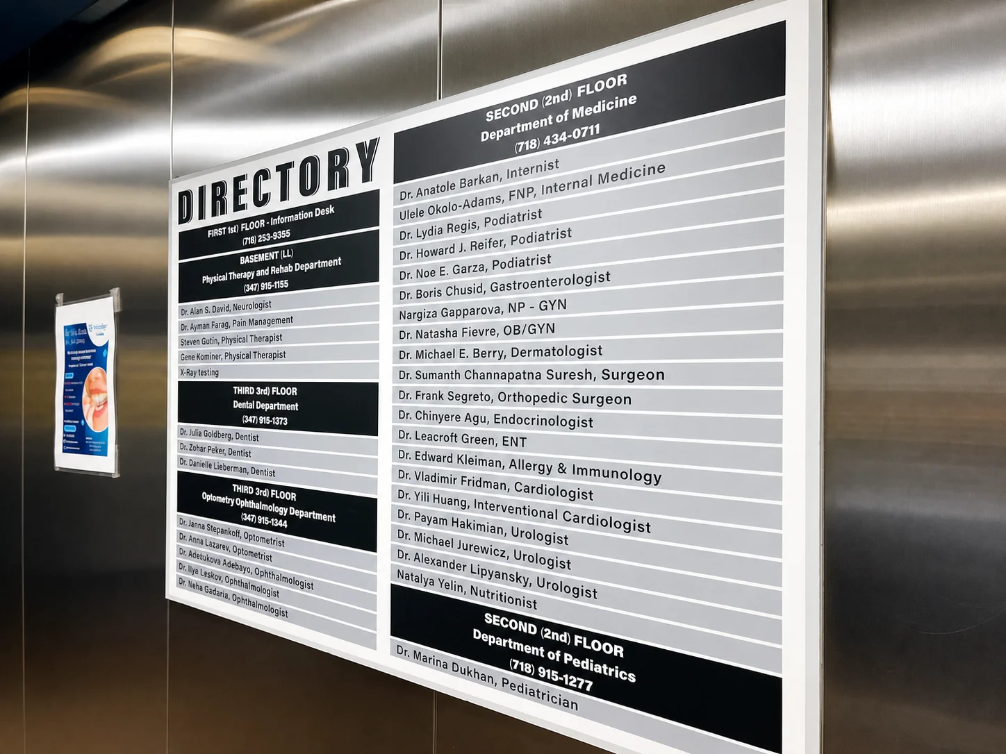 Lobby directory board listing the departments and providers at Be Well Primary Health Care Center